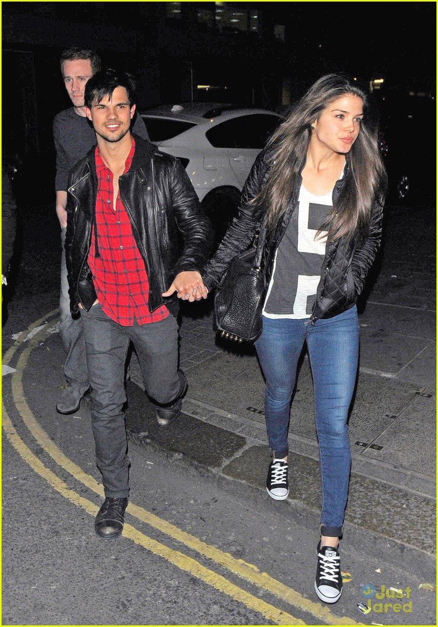 taylor lautner marie avgeropoulos matching jackets london 13